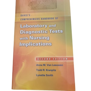 May include: A book titled "Davis's Comprehensive Handbook of Laboratory and Diagnostic Tests with Nursing Implications" by Anne M. Van Leeuwen, Todd R. Kranpitz, and Lynette Smith. The book is in its second edition.