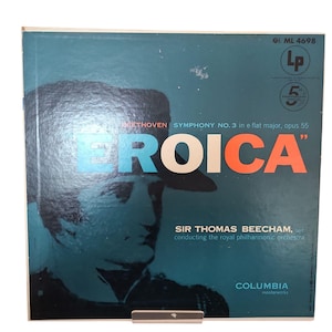 May include: Vintage vinyl record album cover for Beethoven's Symphony No. 3, "Eroica," conducted by Sir Thomas Beecham. The cover is teal with a portrait of a man and the word "EROICA" in large letters. The Columbia label is visible.