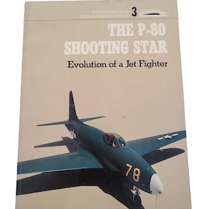 May include: A book cover featuring a blue and white P-80 Shooting Star jet fighter with the text "The P-80 Shooting Star Evolution of a Jet Fighter" and "Famous Aircraft of the National Air and Space Museum" on the cover.