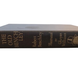 May include: A black hardcover book titled "Chips Off The Old Benchley" by Robert Benchley, illustrated by Gluyas Williams.
