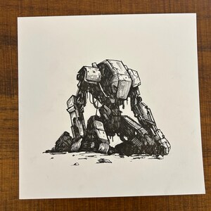 May include: A black and white pen and ink drawing of a mechanical robot kneeling on the ground. The robot has a boxy head and body with detailed mechanical parts. The artwork is on a white square paper.