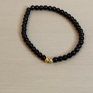 Schwarz-Goldenes Perlenarmband