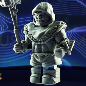 May include: A gray figurine of a hooded warrior holding a weapon. The figure has a detailed design, with a textured cloak and armor. The background is a blue gradient with a wave pattern. The figurine is a collectible.