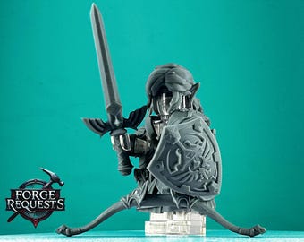 May include: A gray 3D printed figurine of Link from The Legend of Zelda video game series. Link is holding a sword and shield, and is wearing a green tunic and a brown hat. The figurine is posed in a fighting stance.