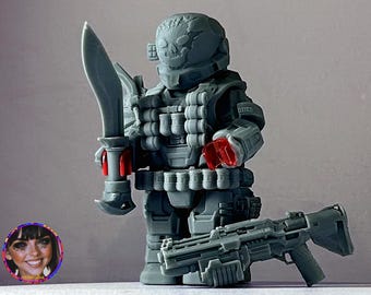 May include: A gray 3D printed action figure of a soldier wearing a helmet with a skull design. The figure is holding a large knife in one hand and a gun in the other. The figure is wearing a lot of ammunition and has red accents on the hands.