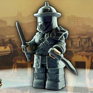 May include: A grey figurine of a post-apocalyptic warrior, wearing a helmet with a respirator, armour, and holding two swords. The background depicts a ruined cityscape. A small, green, cartoonish creature with goggles and the word "Dumpling" is in the lower left.