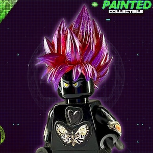 May include: A black Lego minifigure with a purple and red spiky hairpiece. The minifigure is wearing a black shirt with a silver butterfly design and a black heart. The minifigure is holding a black sword in its right hand.