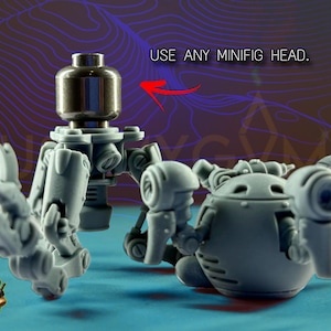 May include: A gray, articulated robot model with a metallic head, featuring multiple joints and mechanical details. The image includes the text "USE ANY MINIFIG HEAD."