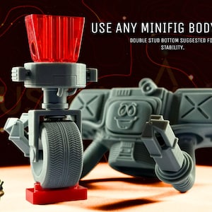 May include: A gray robot-like structure with a red base and a red, ridged top. The design includes a wheel, arms, and a smiling face. Text on the image reads "USE ANY MINIFIG BODY." and "DOUBLE STUD BOTTOM SUGGESTED FOR STABILITY."