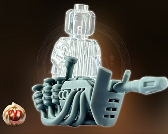 May include: A clear plastic Lego minifigure sits on a gray, detailed, futuristic-looking vehicle with a long, thin barrel. The vehicle has a complex design with multiple pipes and tubes.