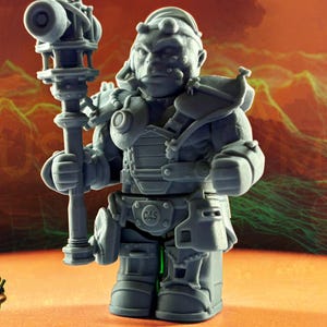 May include: A gray figurine of a fantasy character holding a staff with a large cylindrical top. The figure is wearing armor and has a stern expression. The background is a gradient of orange and green.