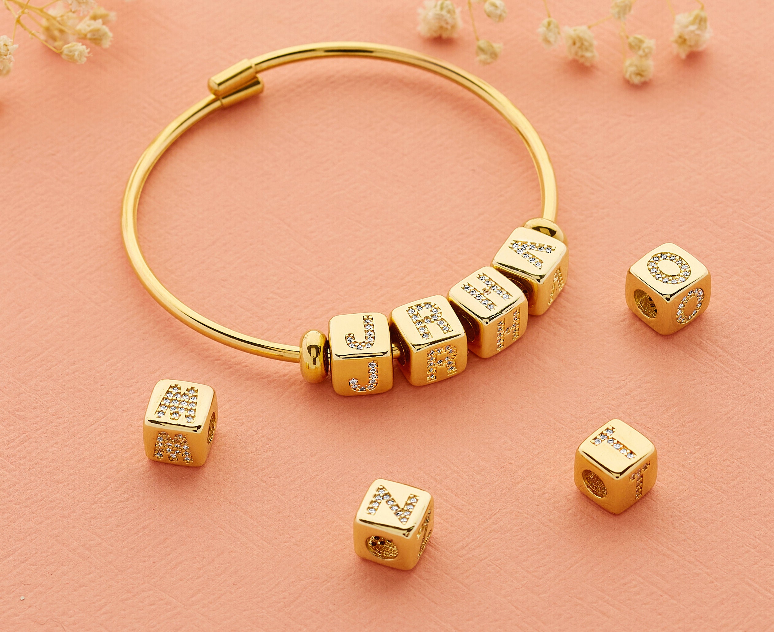 where can I find block letter bracelet beads similar to these? All the ones  i see on  are too small. : r/findfashion