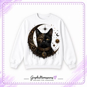 May include: A white crewneck sweatshirt featuring a central graphic of a black cat centered within a large golden crescent moon. The design includes intricate celestial patterns, stars, a sun icon, and a collar with a moon pendant. Text reads GraphicMamasaurus.
