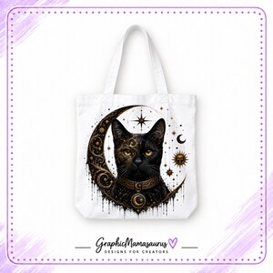May include: A white tote bag featuring a black cat illustration centered on the front. The cat is framed by a large, ornate gold and black crescent moon with celestial star and sun motifs. The cat wears a decorative collar with a moon pendant.