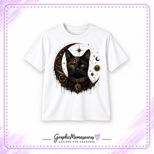 May include: A white short-sleeved t-shirt featuring a graphic of a black cat centered in front of a crescent moon. The cat wears an ornate collar with a moon pendant. The design includes gold and black celestial stars, suns, and filigree patterns.