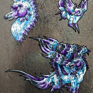 May include: Three stickers featuring mythical creatures with purple, blue, and white fur and feathers. One sticker shows a creature head, another a small flying creature, and the third a large creature with wings and a long tail in a dynamic pose.