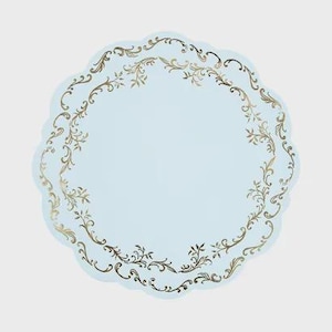 May include: A round, light blue paper plate with a scalloped edge. The plate features a decorative border of metallic gold filigree and scrolling leaf patterns that circle the inner edge, creating a detailed frame against the solid blue center.