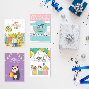 May include: Four different birthday cards with colorful designs. The cards feature a crocodile, a panda, and cartoon animals. The cards have the text "Happy Birthday" on them.