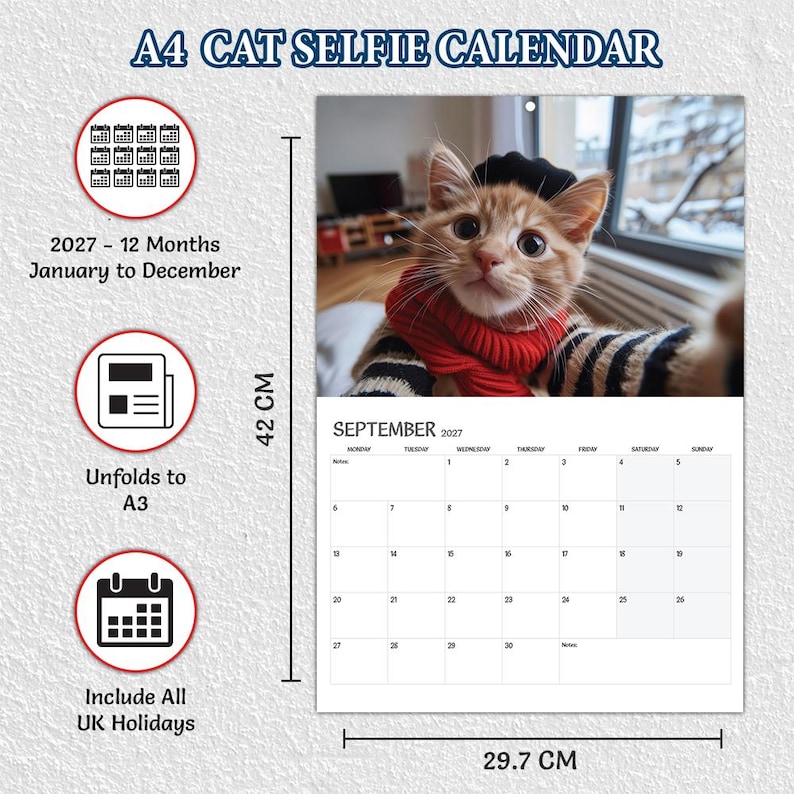 May include: A 2027 A4 cat selfie wall calendar featuring a ginger kitten wearing a red scarf and black beret. The calendar displays the month of September 2027 with a grid layout. It measures 42 cm by 29.7 cm and includes 12 months from January to December.