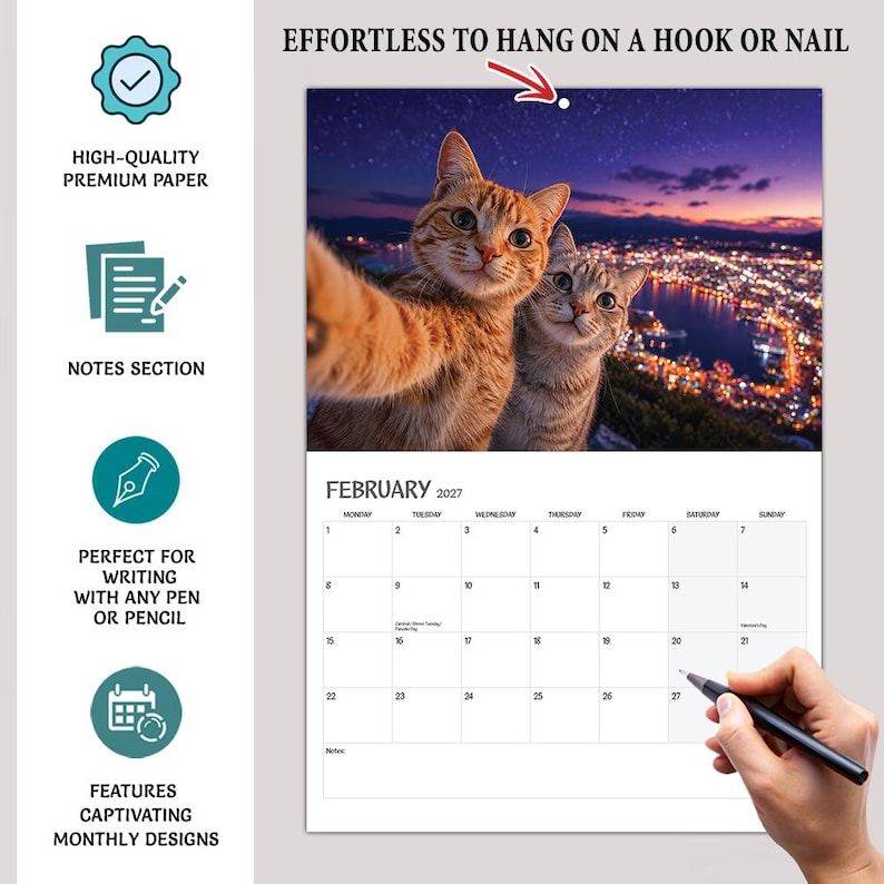 May include: A 2027 wall calendar for February featuring a photograph of two cats taking a selfie against a night cityscape. The calendar includes a grid for dates, a notes section, and a hole at the top for hanging. Text includes EFFORTLESS TO HANG ON A HOOK OR NAIL.