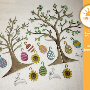 May include: Laser cut wooden Easter tree decorations with bunnies, eggs, and sunflowers. The design includes two trees with branches and leaves. The text "Laser Ready Files SVG, PDF, DXF *** Digital Download ***" is on the right side of the image.