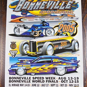 May include: A poster for Bonneville Speed Week 2005, featuring stylized illustrations of a motorcycle, a hot rod, and a race car with flames. The poster includes event dates and locations, with the text "Bonneville Speed Week" at the top.