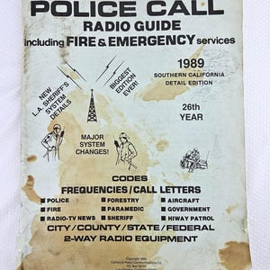 May include: A vintage "Police Call Radio Guide" from 1989, featuring information on fire, emergency services, and radio frequencies. The cover includes illustrations of police officers and a radio tower, with the text "Southern California Detail Edition."