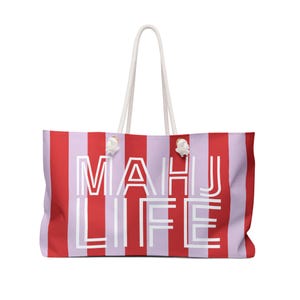 May include: Large tote bag with red and lavender vertical stripes. The bag features white rope handles and the text "MAHU LIFE" in white block letters. A stylish and spacious beach bag.