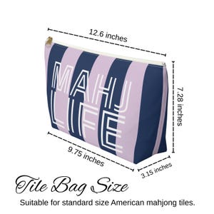 May include: A rectangular zippered tile bag with a striped pattern in lavender and navy blue. The bag features the text "MAHU LIFE" in white. The bag measures 12.6 inches long, 7.28 inches high, 9.75 inches wide, and 3.15 inches deep.