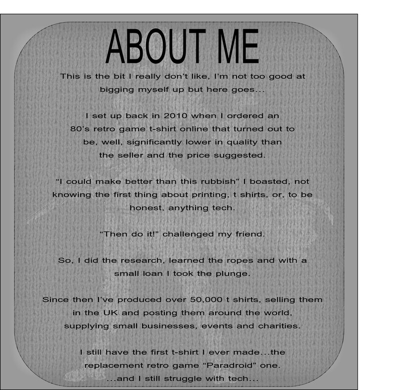 May include: A grey informational sign with rounded corners featuring black text titled ABOUT ME. The text details a business history starting in 2010, mentioning the production of over 50,000 t-shirts, the Paradroid retro game design, and ongoing technical struggles.
