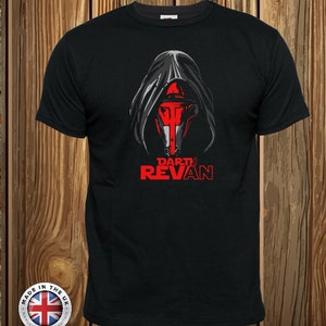 May include: A black short-sleeved t-shirt featuring a graphic of a hooded figure with a red mask and the text "DARTH REVAN" in red lettering below the illustration. The design is centred on the chest of the garment.
