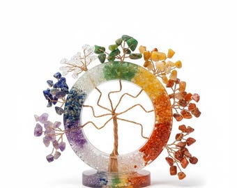 May include: A decorative tree sculpture with a copper wire trunk and branches, surrounded by a colorful ring. The ring is segmented into rainbow colors and adorned with small gemstones. The base is also multi-colored.