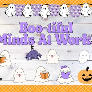May include: A Halloween-themed illustration with the text "Boo-tiful Minds At Work!". The image features cartoon ghosts, a spider, a black cat, and a jack-o'-lantern. Some ghosts are reading books. A banner of ghosts and bats decorates the top.