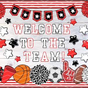 May include: A decorative sign with the words "WELCOME TO THE TEAM!" in red and black. The sign features sports-themed graphics, including a basketball, football, soccer ball, and pom-poms, with star accents. The border is red and white.