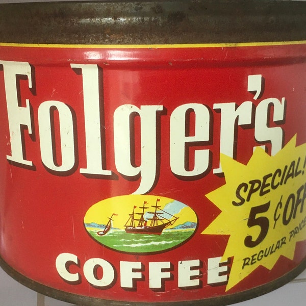 Il logo della lattina di caffè di Tin Folger degli anni '50 pubblicizza i cimeli americani