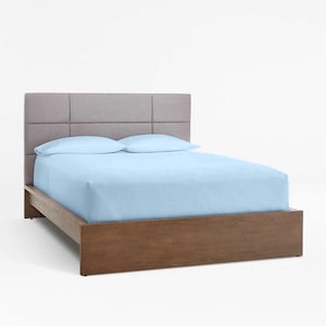 May include: A light blue upholstered bed frame with a wood headboard and footboard. The headboard has a tufted design with square panels.