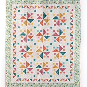 This Skip to My Lou Quilt Pattern shows happy pinwheels dancing in a square.