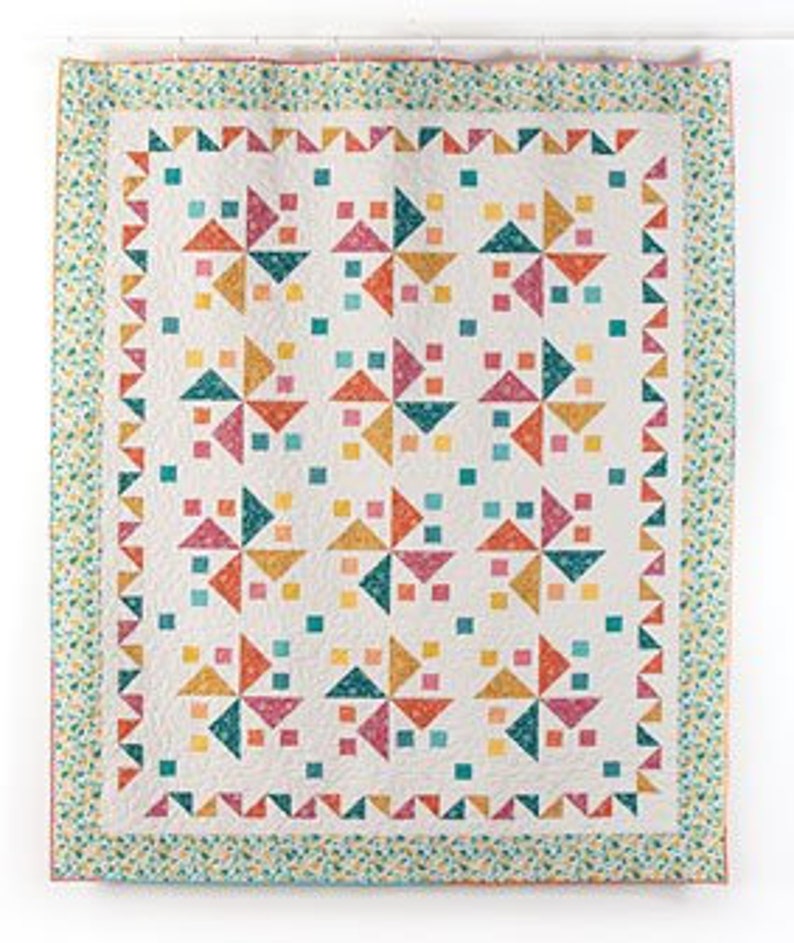 This Skip to My Lou Quilt Pattern shows happy pinwheels dancing in a square.