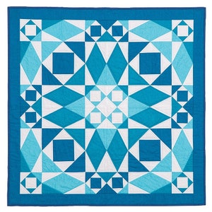 May include: A blue and white geometric quilt with a repeating pattern of squares and triangles. The quilt is made with a variety of shades of blue and white fabric.