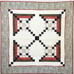 This Appian Way Quilt Pattern is a variation on a log cabin block that uses an Ohio Star Quilt Block in the center.