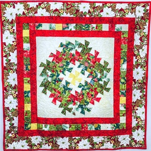 This no-waste Wreath and Garland Quilt Pattern is made using the Lil Twister ruler.