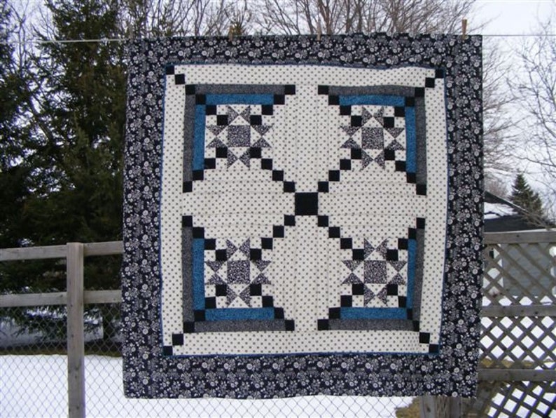 Made by Liz, this Appian Way Quilt Pattern is a variation on a log cabin block that uses an Ohio Star Quilt Block in the center.