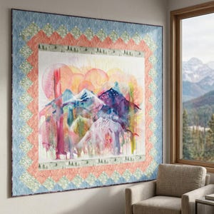 May include: Large, square quilt with a watercolor mountain scene. The quilt features a central image of colorful mountains with a sunset backdrop. The border includes a light blue diamond pattern, a peach-colored band, and a green band with small trees.