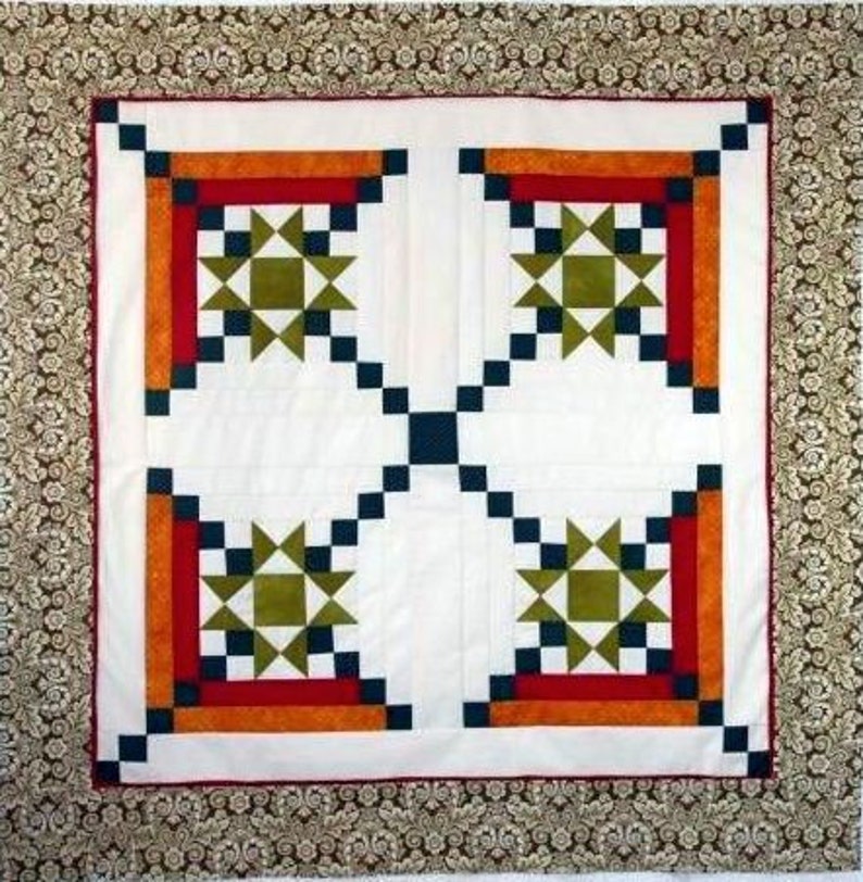 Made by Laura, this Appian Way Quilt Pattern is a variation on a log cabin block that uses an Ohio Star Quilt Block in the center.