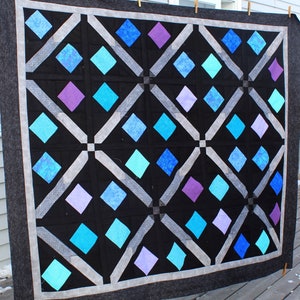This Aim High quilt is designed for charms but would look great in scraps.