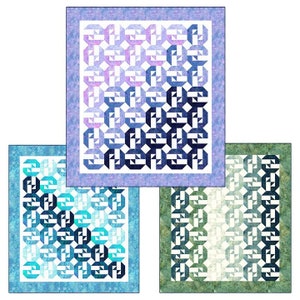 May include: Three colorful quilts with geometric patterns. The quilts feature a repeating design of interlocking shapes in shades of blue, teal, and green. Each quilt has a patterned border. The quilts are displayed on a white background.