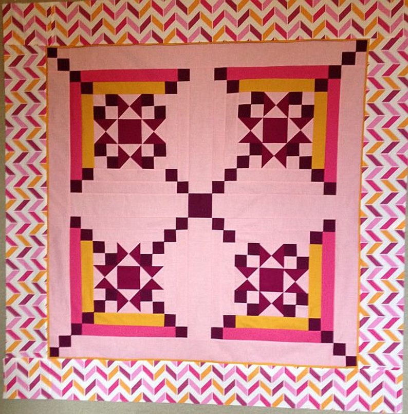 Made by Betty, this Appian Way Quilt Pattern is a variation on a log cabin block that uses an Ohio Star Quilt Block in the center.