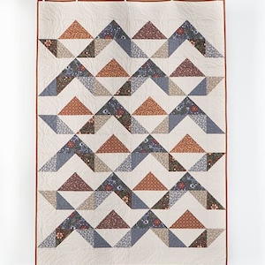 This Dusky Mountains Baby Quilt Pattern is easy to make.