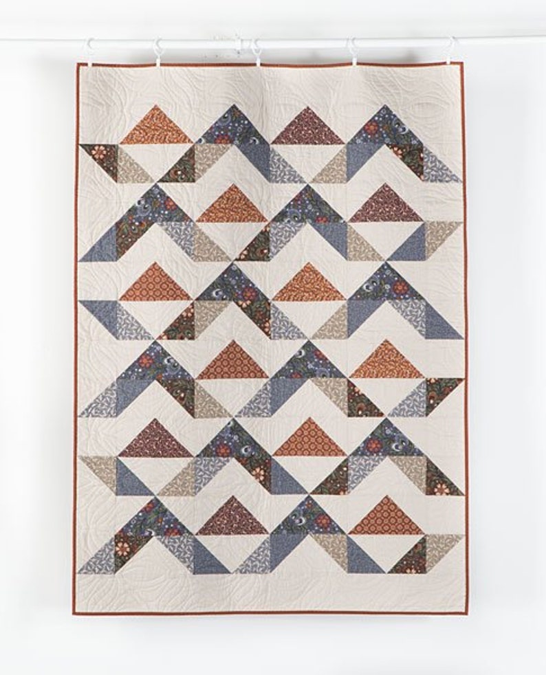 This Dusky Mountains Baby Quilt Pattern is easy to make.