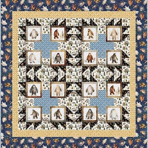 May include: A quilt featuring a repeating pattern of a stylized Bigfoot figure in a square frame. The quilt is made up of a patchwork of different fabrics, including black, white, and brown. The quilt is surrounded by a border of blue and yellow fabric.